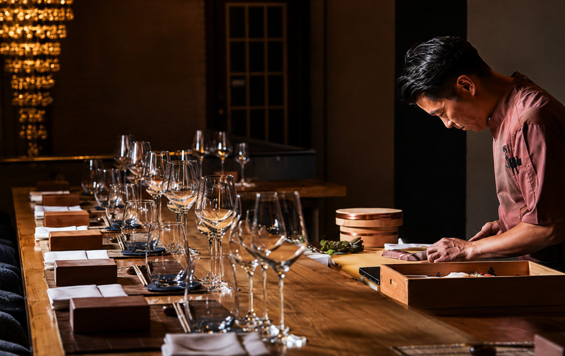 Chef preparing the counter for a carefully paced service